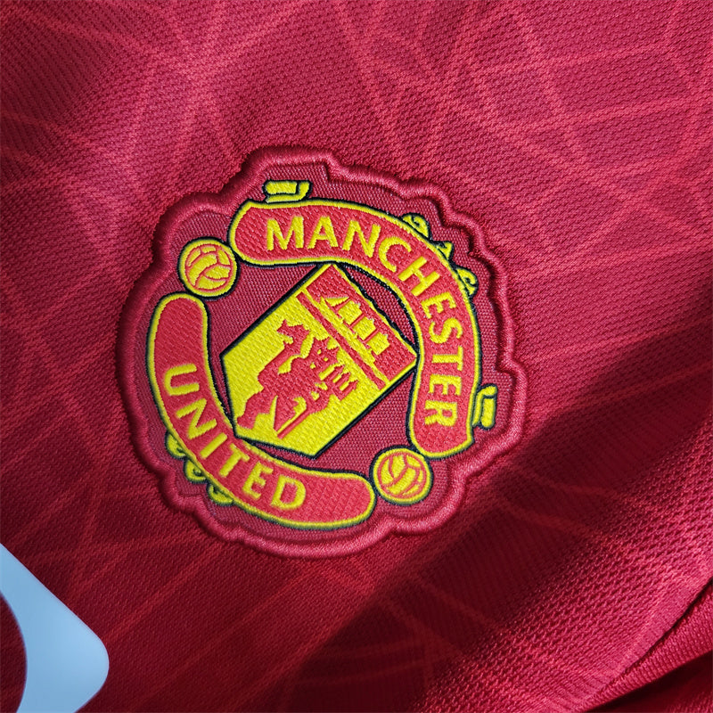 MANCHESTER UNITED - KIDS' HOME KIT 23/24