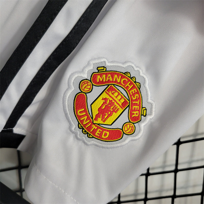 MANCHESTER UNITED - KIDS' HOME KIT 23/24