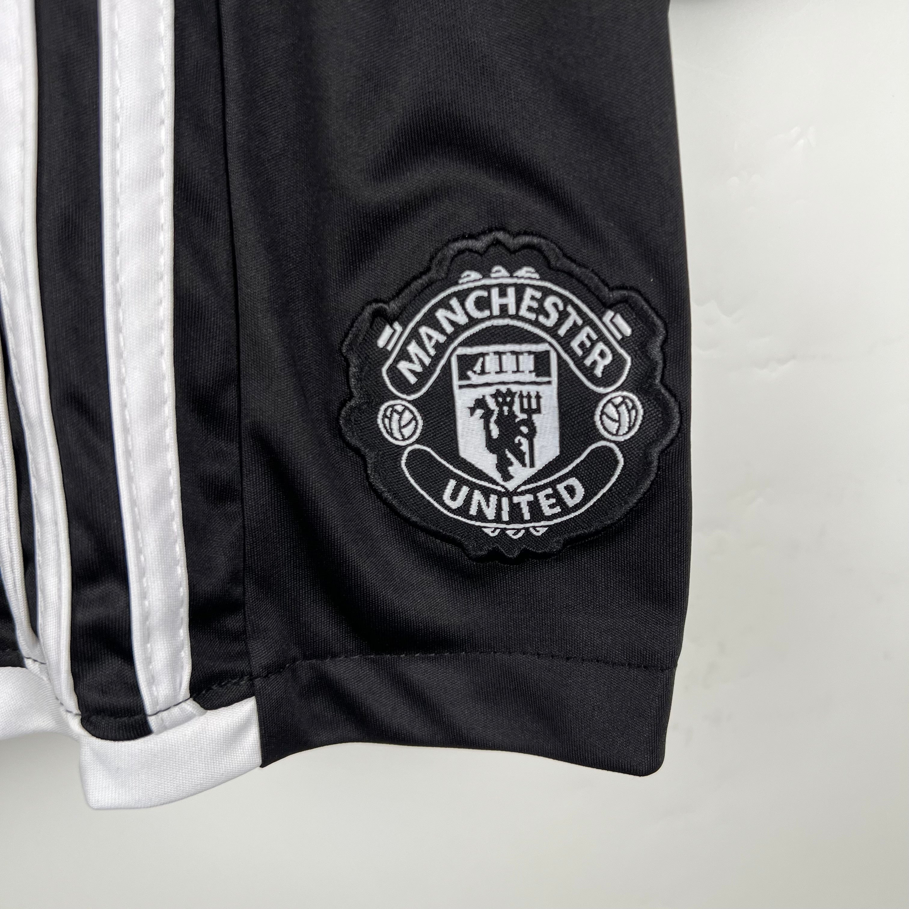 MANCHESTER UNITED - KIDS' AWAY KIT 23/24