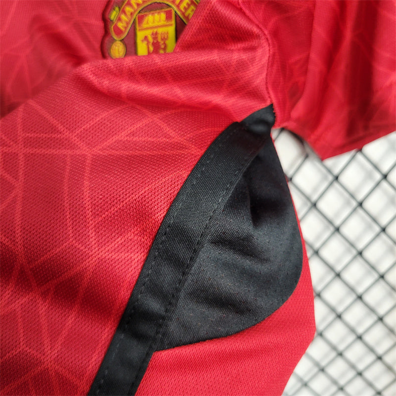 MANCHESTER UNITED - KIDS' HOME KIT 23/24